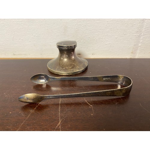 51 - A pair of Georgian sugar tongs and a silver inkwell (a/f) -