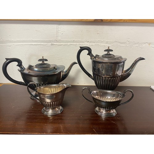 62 - A modern silver four piece tea service, each piece with half gadrooned body, Sheffield 1973 -