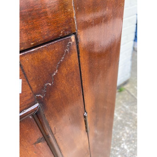 343 - A George III mahogany and inlaid corner cupboard -