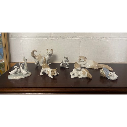 129 - Three Lladro cats, two Nao cats and two Lladro geese groups (7) -