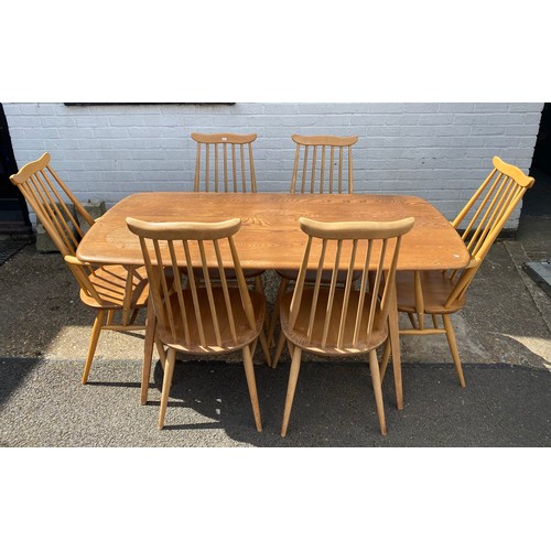 352 - An Ercol dining table, with six Goldsmith dining chairs -