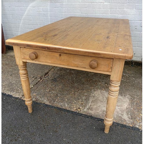 361 - A reclaimed pine farmhouse kitchen table, with two end drawers and turned legs -