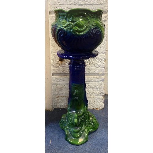 130 - An Art Nouveau blue and green glazed jardiniere on stand -