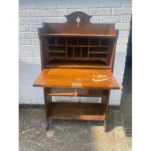 366 - An Arts & Crafts oak hall bureau, in hammer copper mounts, fall front and open shelves -