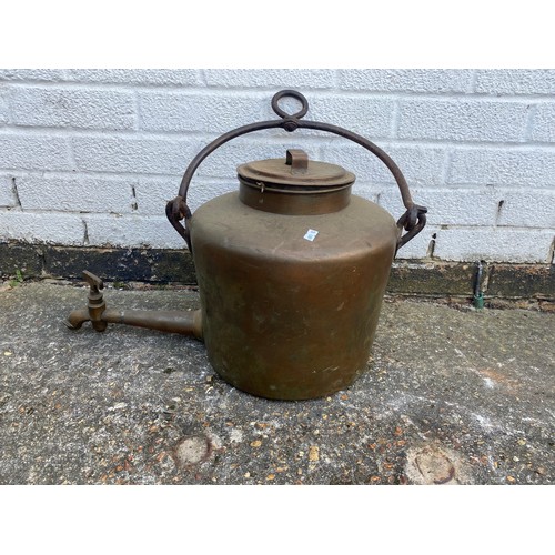 447 - A large copper fire kettle, with swing handle -