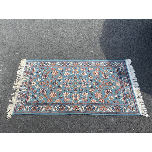 386 - A Beluchi rug approximately 195 x 135cm and another smaller rug -