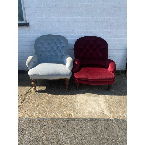 393 - A pair of button back armchairs, each on short legs -