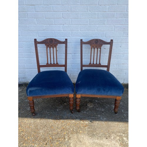 395 - A pair of Edwardian salon chairs -