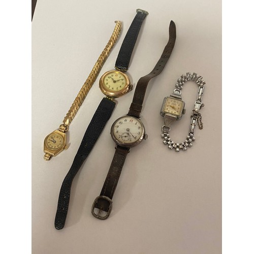 15 - A lady's 9ct gold cased wristwatch, another in plated case and a silver cased watch, one other (4) -