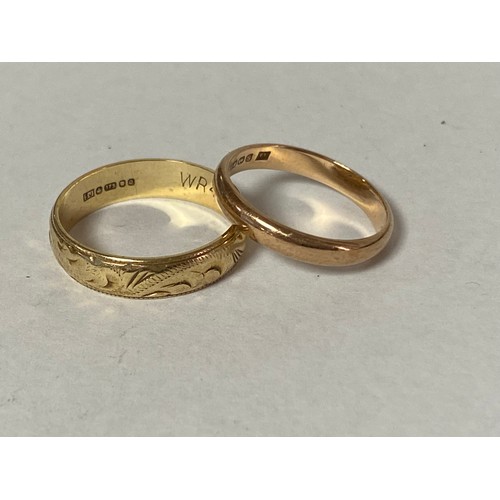 21 - A 9ct gold wedding band, with engraved decoration and another 9ct gold band (2) -