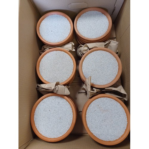 409 - A quantity of terracotta dishes, with resin sand -