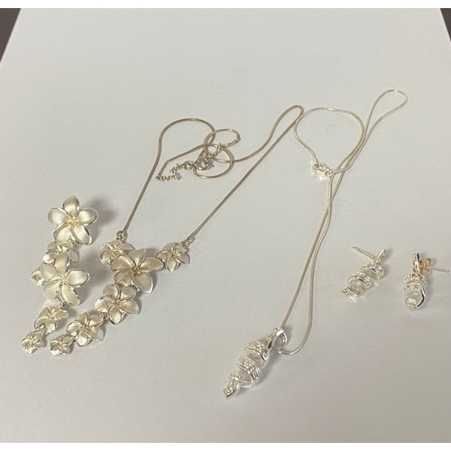5 - A modern silver necklace and earring suite, each piece designed as flowerheads, together with anothe... 