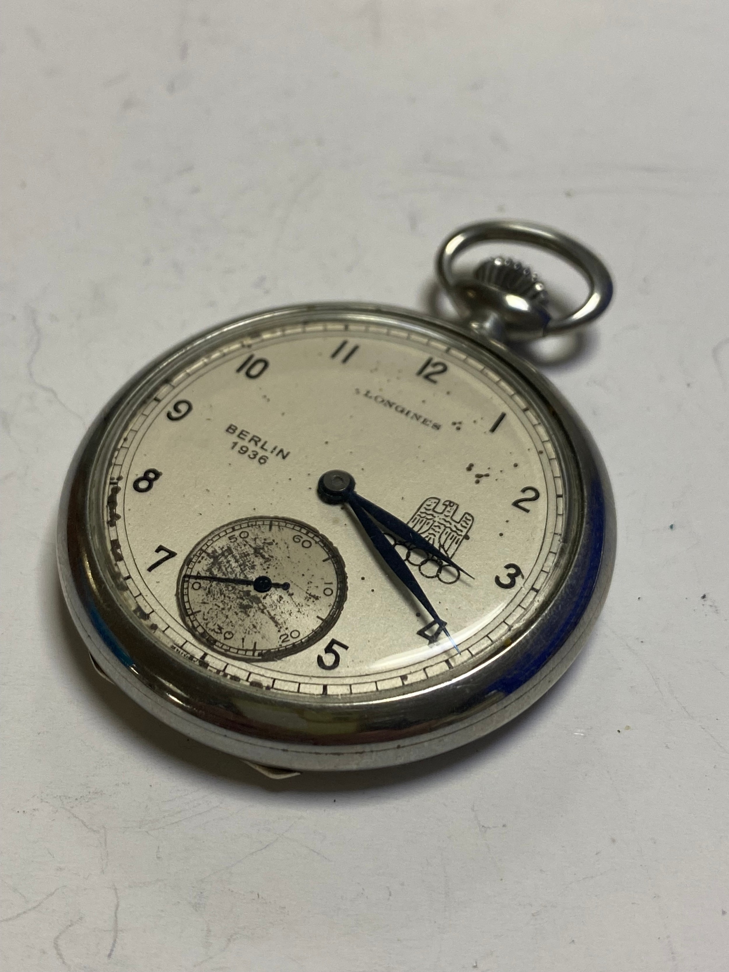 A Longines open face pocket watch the signed dial bearing Berlin