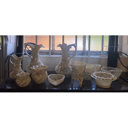 67 - A pair of Belleek jugs, with floral encrusted decoration, and other Belleek china -