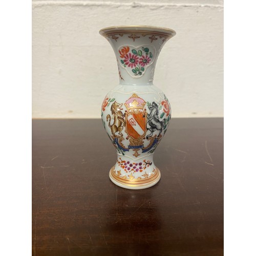 70 - A Chinese armorial vase, enamelled with crest and flowers -