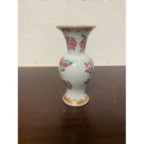 70 - A Chinese armorial vase, enamelled with crest and flowers -