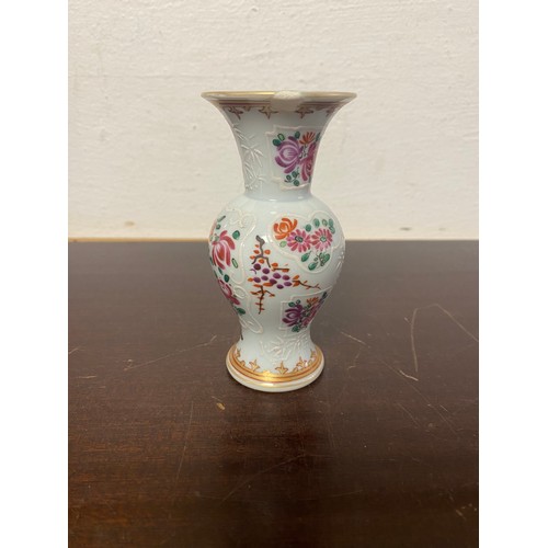 70 - A Chinese armorial vase, enamelled with crest and flowers -