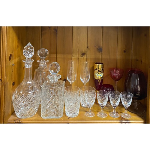 82 - Three cut glass decanters and stoppers, and other glassware -