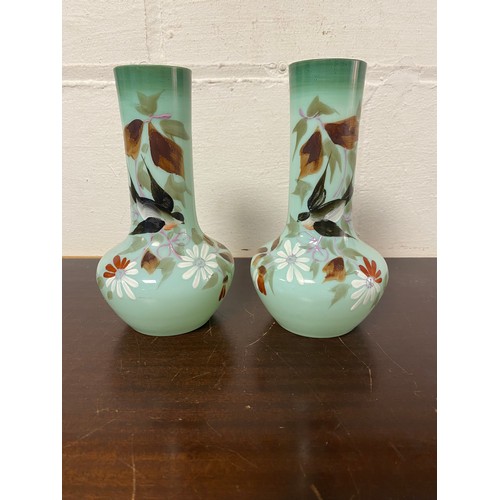100 - A pair of Edwardian enamelled glass vases -