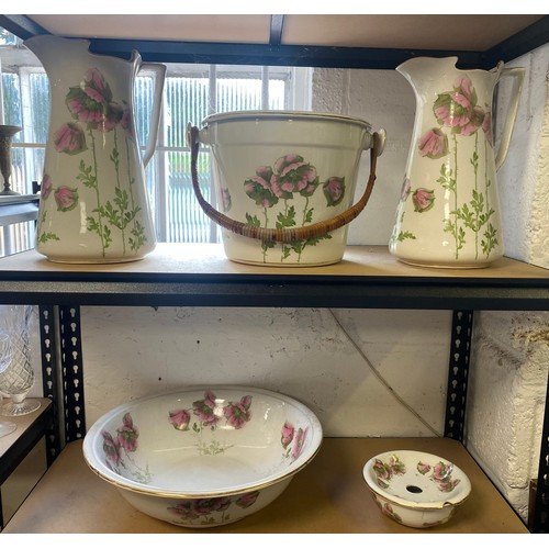 104 - A toilet set, each piece decorated with pink poppies (a/f) -