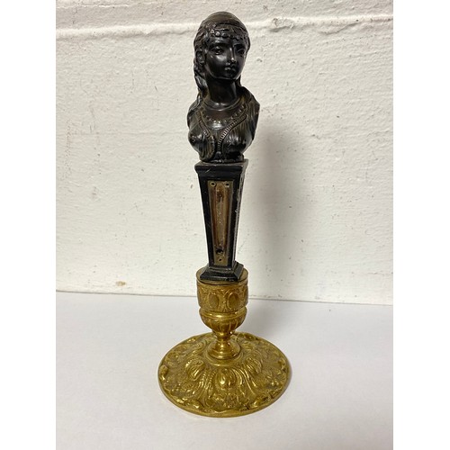 53 - A bronze bust of a lady, mounted on brass base -