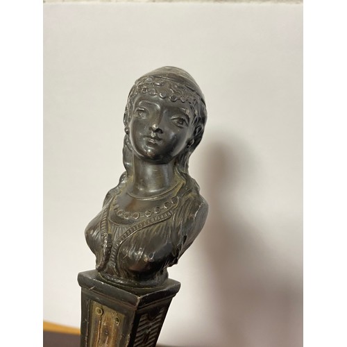 53 - A bronze bust of a lady, mounted on brass base -