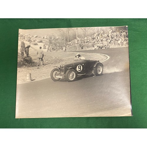 140 - A group of four black and white photographs of motor racing interest, believed to be Goodwood, inclu... 