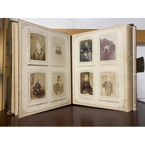 142 - A Victorian photograph album, containing approximately 100 carte de visites -