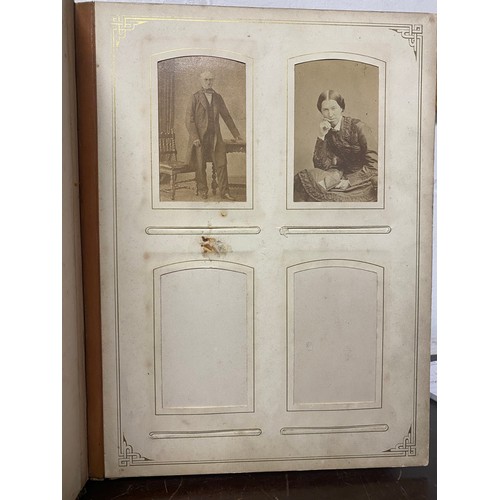 142 - A Victorian photograph album, containing approximately 100 carte de visites -
