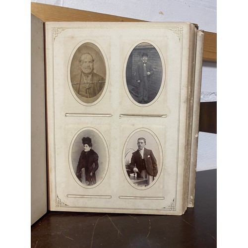 142 - A Victorian photograph album, containing approximately 100 carte de visites -