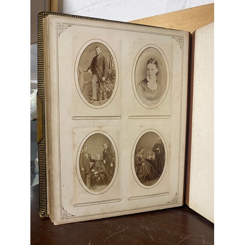 142 - A Victorian photograph album, containing approximately 100 carte de visites -