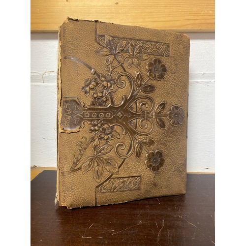 143 - A Victorian photograph album, containing approximately 68 carte de visites and photographs, and some... 