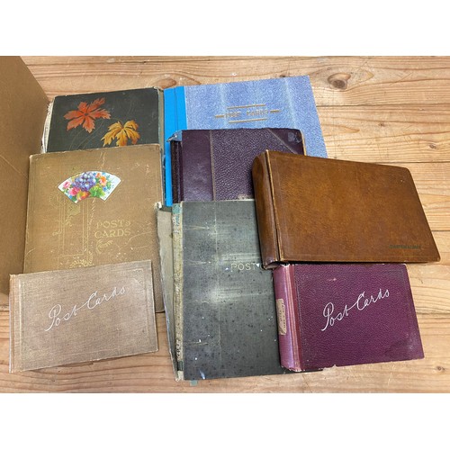 150 - Postcards: a quantity of empty albums and a large quantity of loose plastic sleeves -