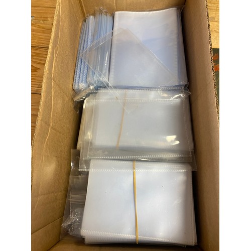 150 - Postcards: a quantity of empty albums and a large quantity of loose plastic sleeves -