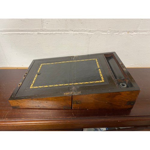 56 - A 19th century brass bound walnut lap desk -