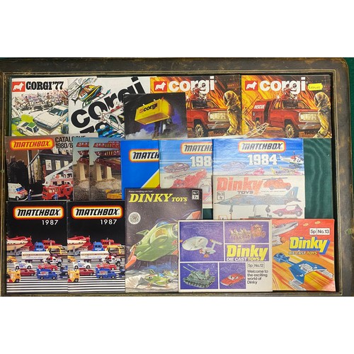 163 - A group of approximately 16 Corgi, Matchbox and Dinky catalogues, mostly 1980s -