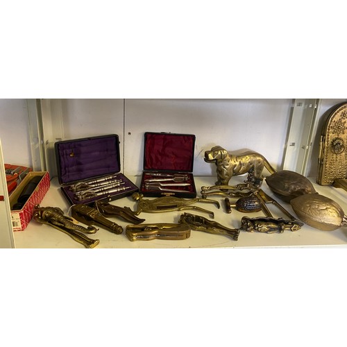 168 - A quantity of novelty nutcrackers, including a pair cast as a brass dog, figural pairs etc -