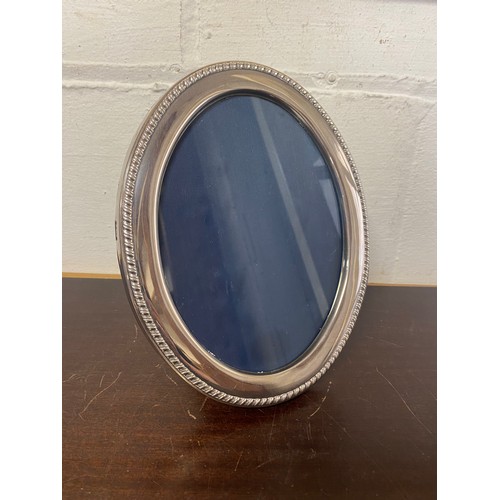 12 - A Queen Elizabeth II silver photograph frame, Sheffield 1995 -