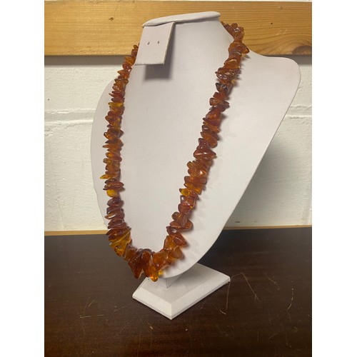 15 - An amber necklace, composed of graduated tumbled chips -