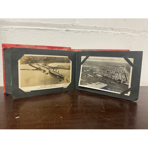 183 - Postcards: an album of approximately 58 postcards, to include Southampton docks and port, RMS Majest... 