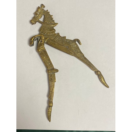 190 - A Persian brass nut cracker/slicer of horse design -