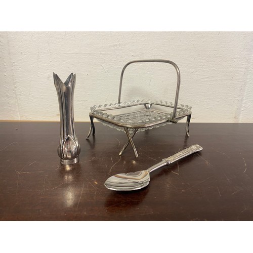 30 - A silver bud vase, a silver handled preserves spoon and a glass butter dish on plated stand -