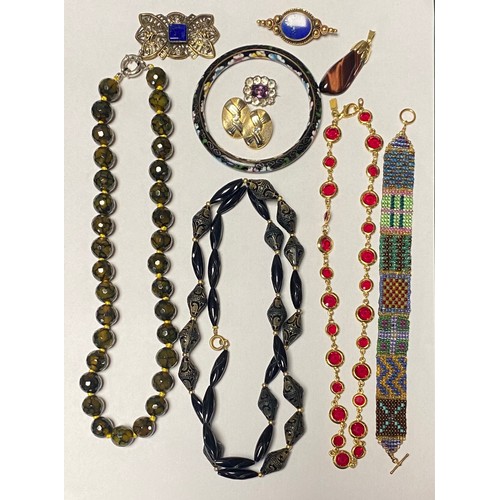 29 - A small lot of jewellery items, including bead necklaces, enamel bangle etc -