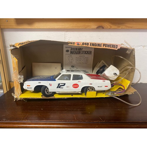 164 - Toys: a Cox Steerable Matador Stocker car -