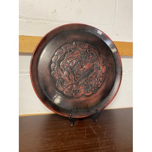 130 - A large Japanese tray, moulded to the centre with a dragon in a roundel -