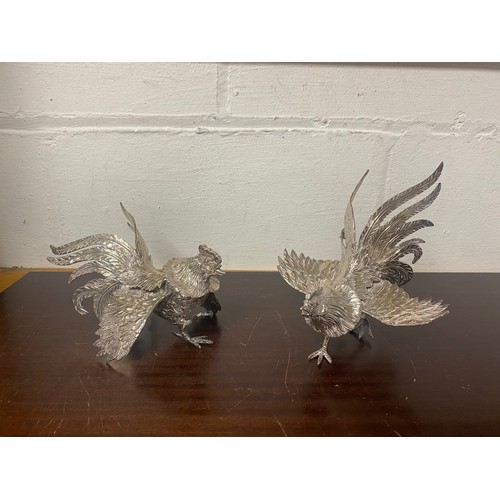 19 - A pair of silver plated table ornaments -