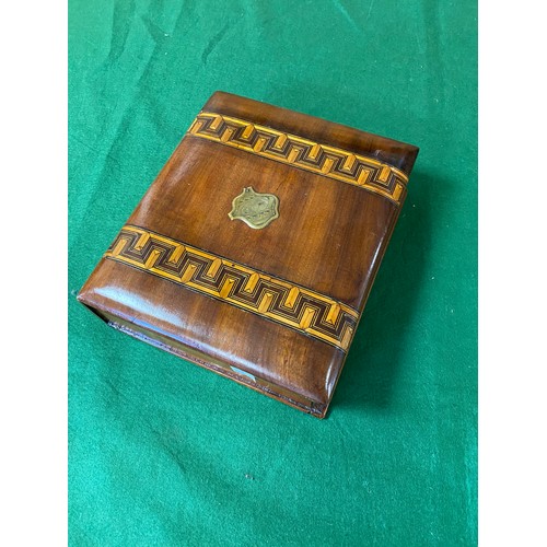 135 - A mid Victorian Tunbridge style writing box, of book design, with central brass escutcheon between t... 