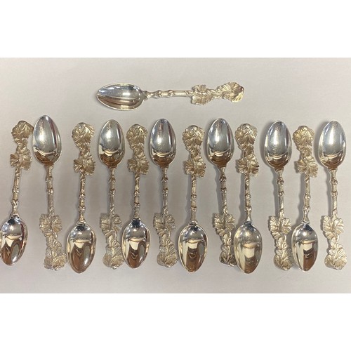 34 - A set of thirteen silver teaspoons, each stamped sterling, with leaf handle -