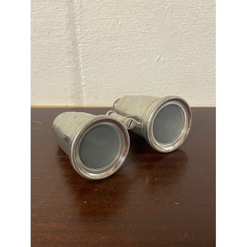 136 - A pair of aluminium travelling drink containers in the shape of binoculars -