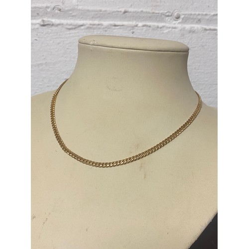 65 - A 9ct gold flattened curb link necklace -